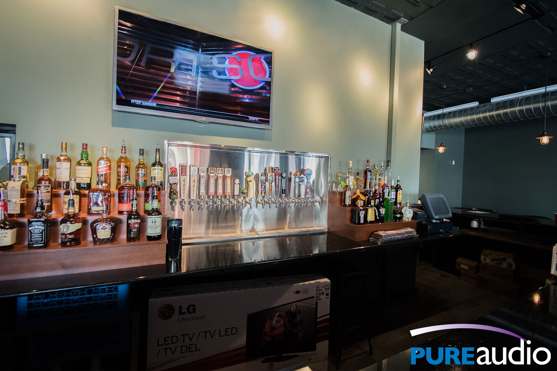 Watch Sports Center at your bar on a mounted flat-screen TV with completely hidden wires!
